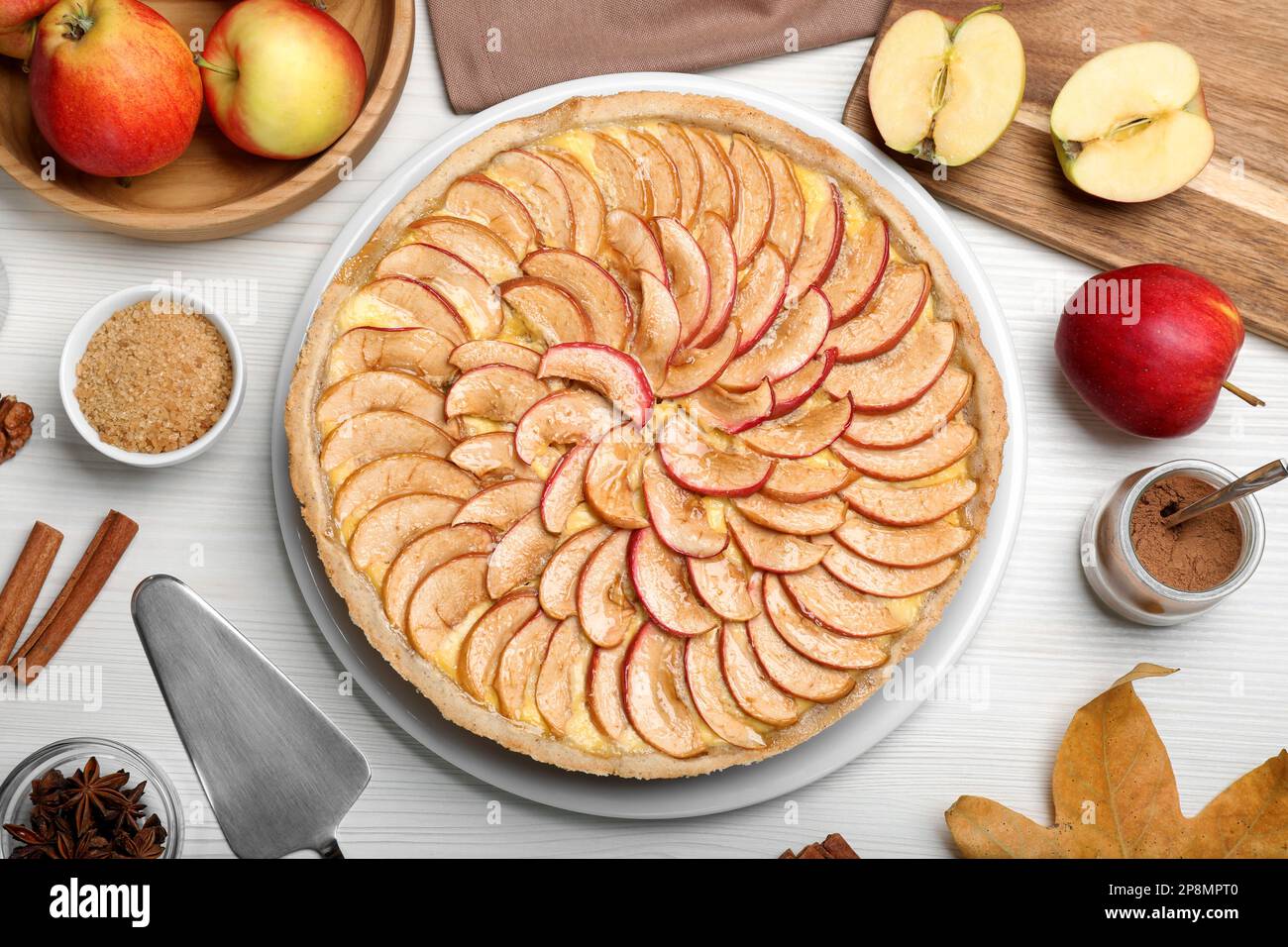 Flat lay composition with tasty apple pie on white wooden table Stock Photo