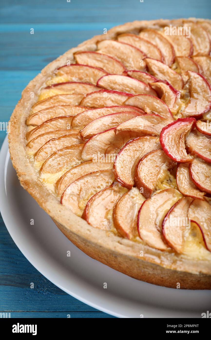 Tasty apple pie on light blue wooden table, closeup Stock Photo