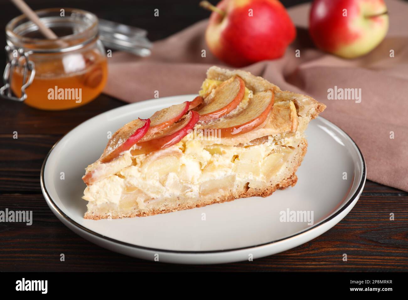 Piece of delicious homemade apple pie on wooden table Stock Photo