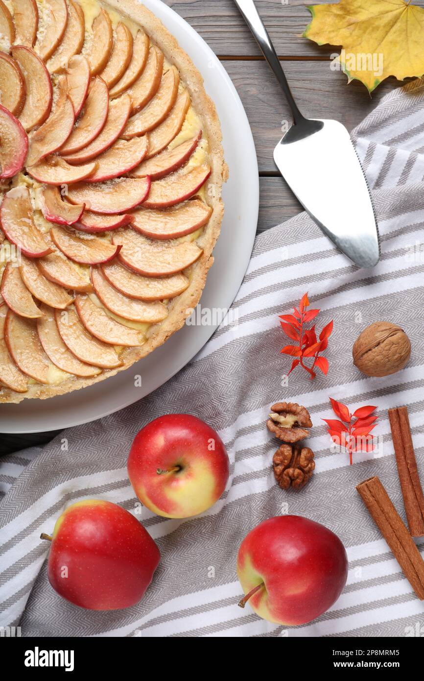 Flat lay composition with freshly baked delicious apple pie on wooden table Stock Photo