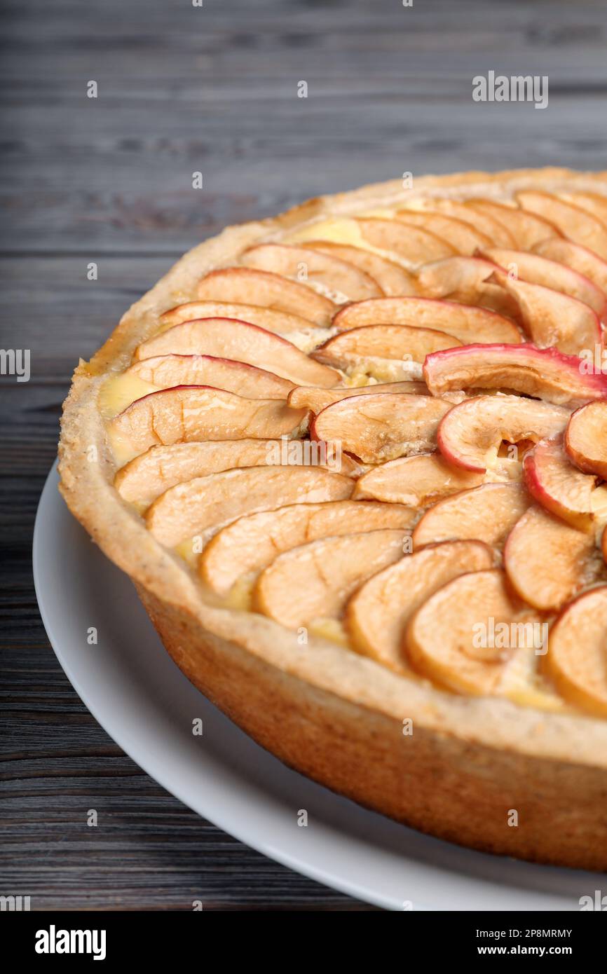 Freshly baked delicious apple pie on wooden table, closeup Stock Photo