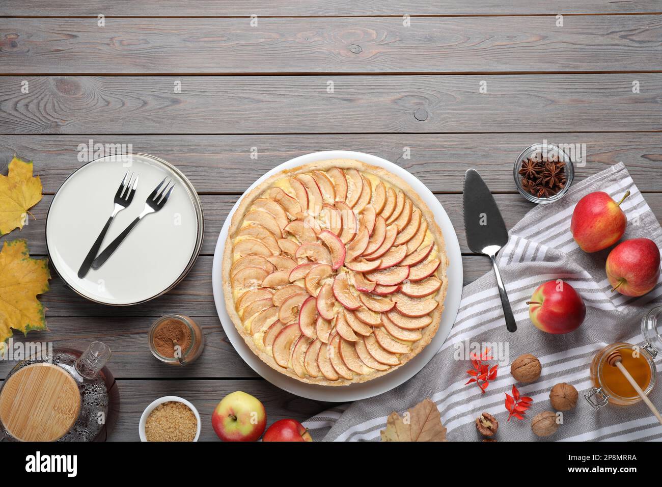 Flat lay composition with freshly baked delicious apple pie on wooden table. Space for text Stock Photo