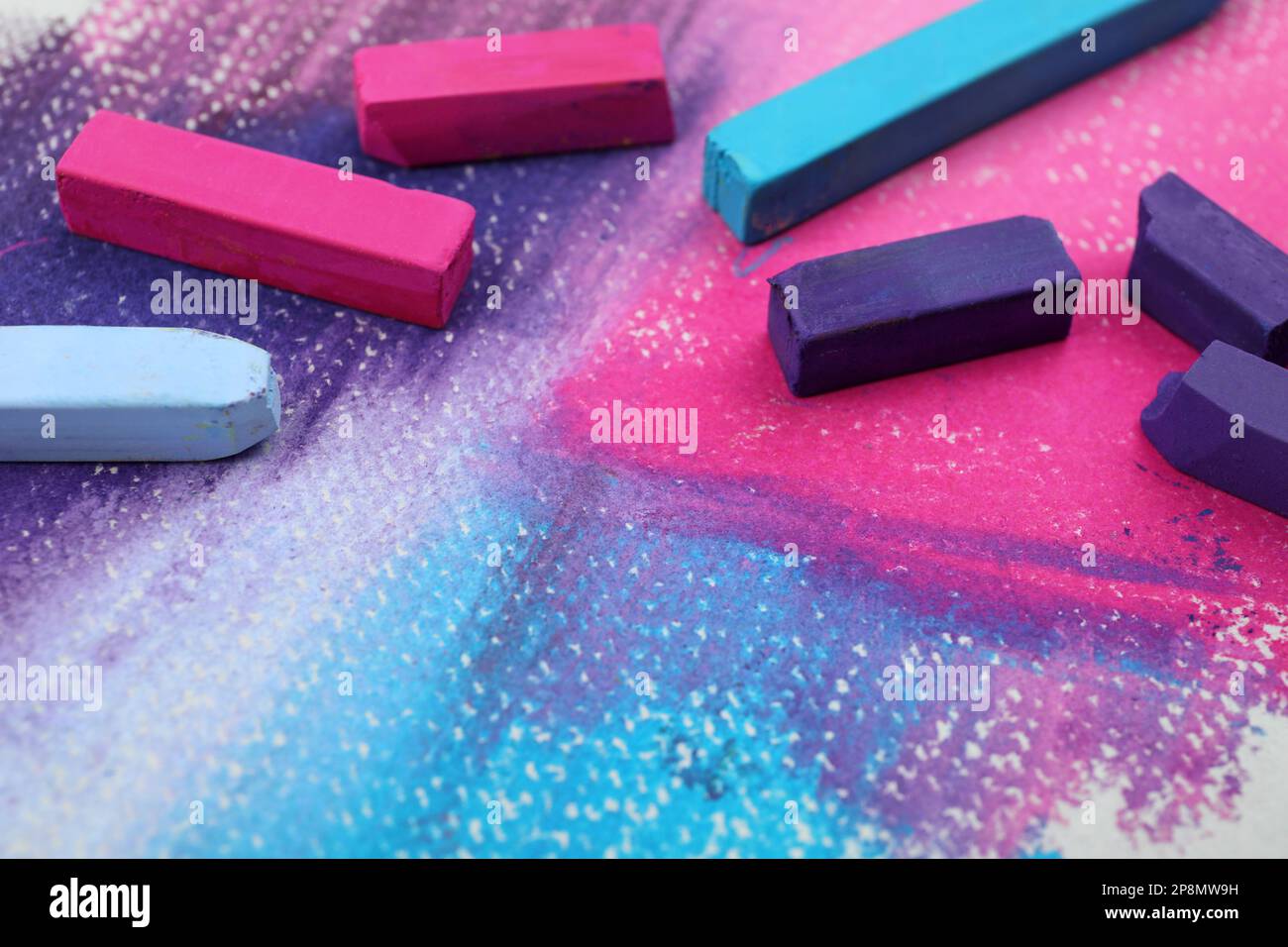 Colorful pastel chalks on abstract painting, closeup. Drawing materials Stock Photo Alamy