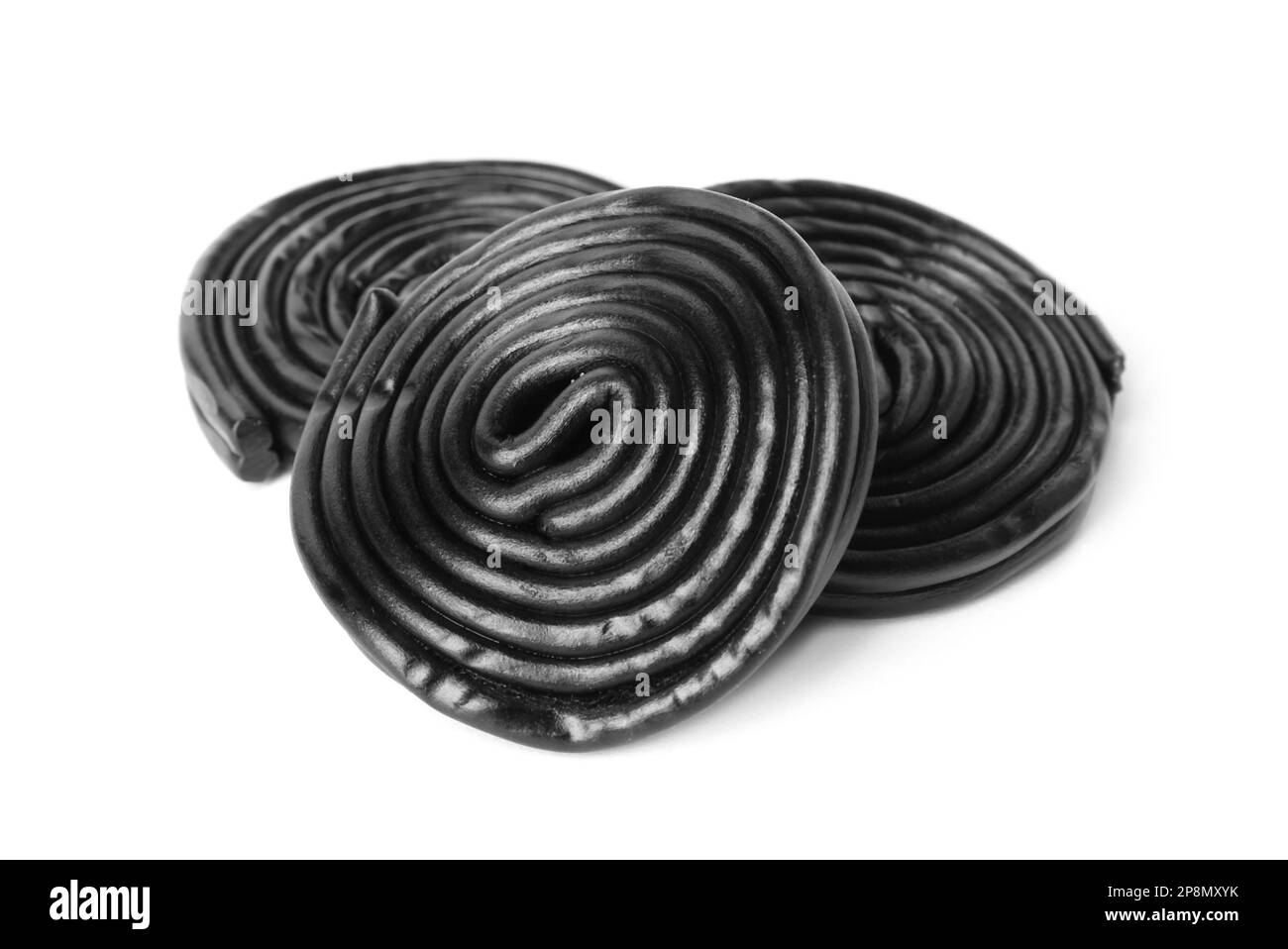 Tasty black liquorice candies on white background Stock Photo Alamy