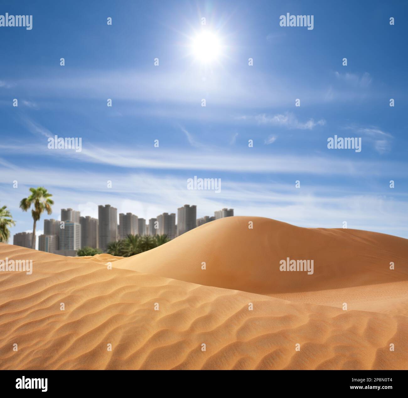 Sandy desert and beautiful view of city on horizon Stock Photo