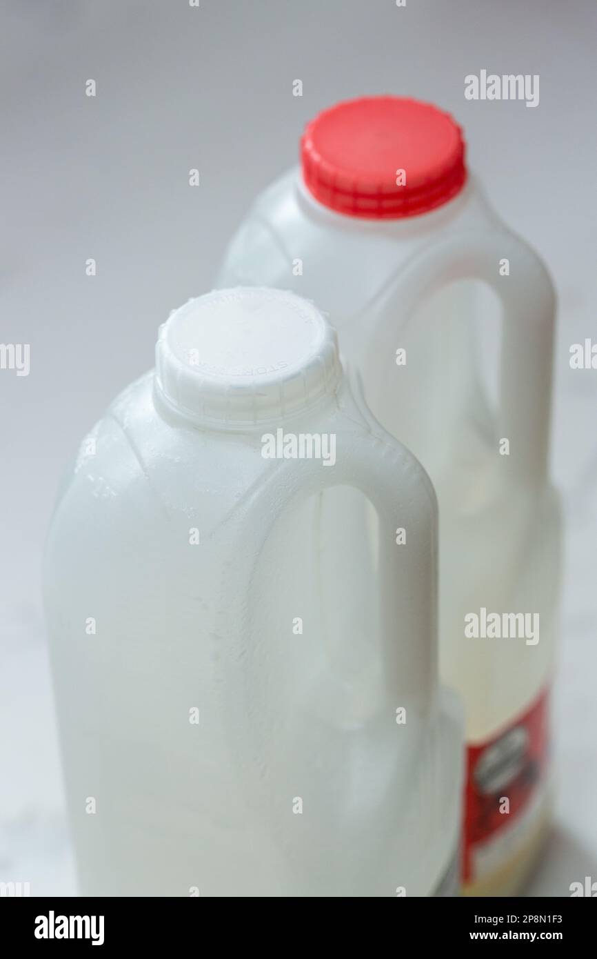 https://c8.alamy.com/comp/2P8N1F3/coloured-milk-bottle-caps-are-changing-to-clear-or-white-to-help-recyclability-2P8N1F3.jpg