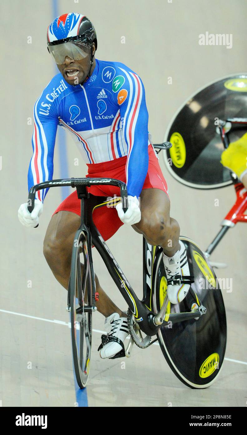 Gregory Bauge, of France reacts after he clashed with his compatriot Kevin  Sireau, unseen, who crashed in the second semi final of the Men's Sprint at  the World Track Cycling Championships at