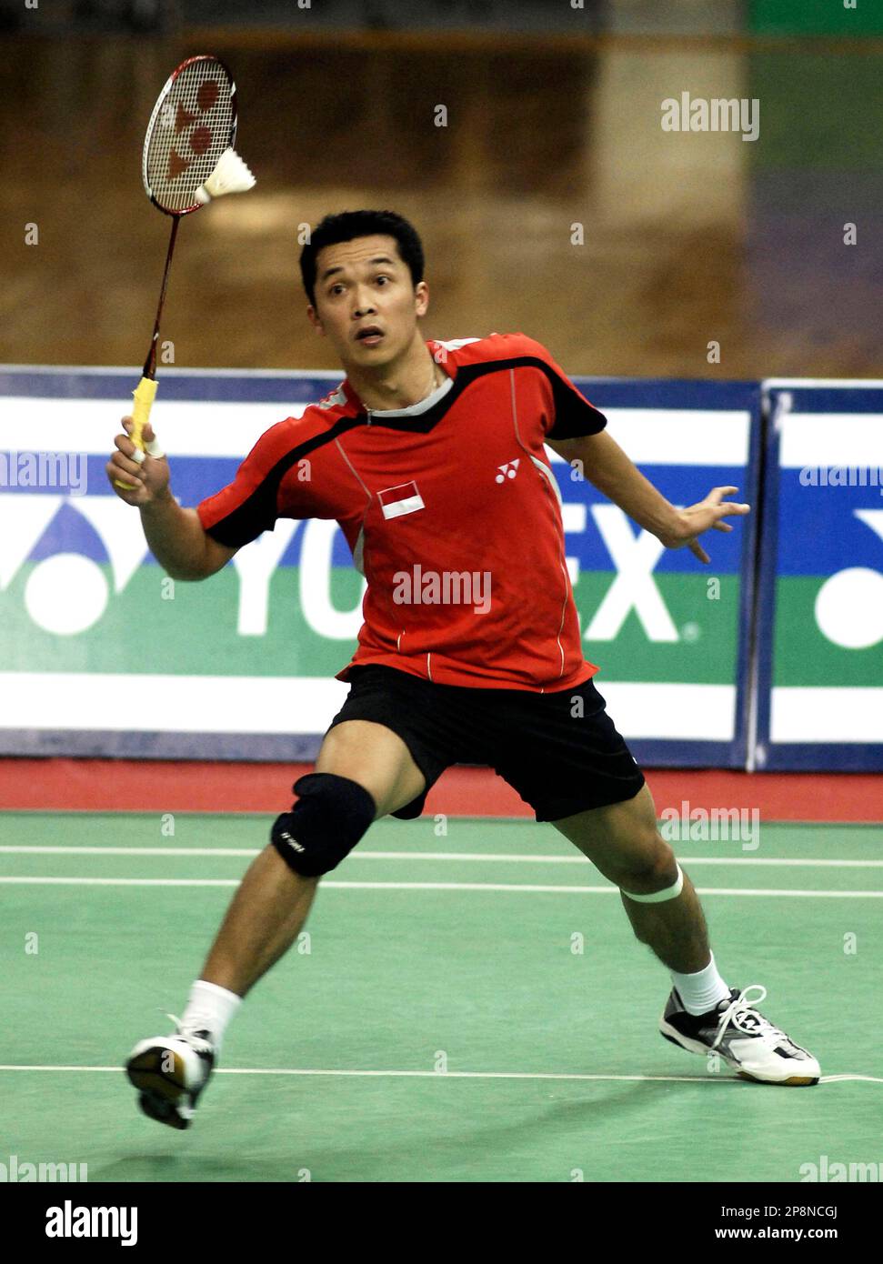 Indonesian badminton player Taufik Hidayat plays a shot against fellow Indonesian Tommy Sugiarto in the mens single semifinal of the Yonex Sunrise India Open 2009 in Hyderabad, India, Saturday, March 28, 2009.