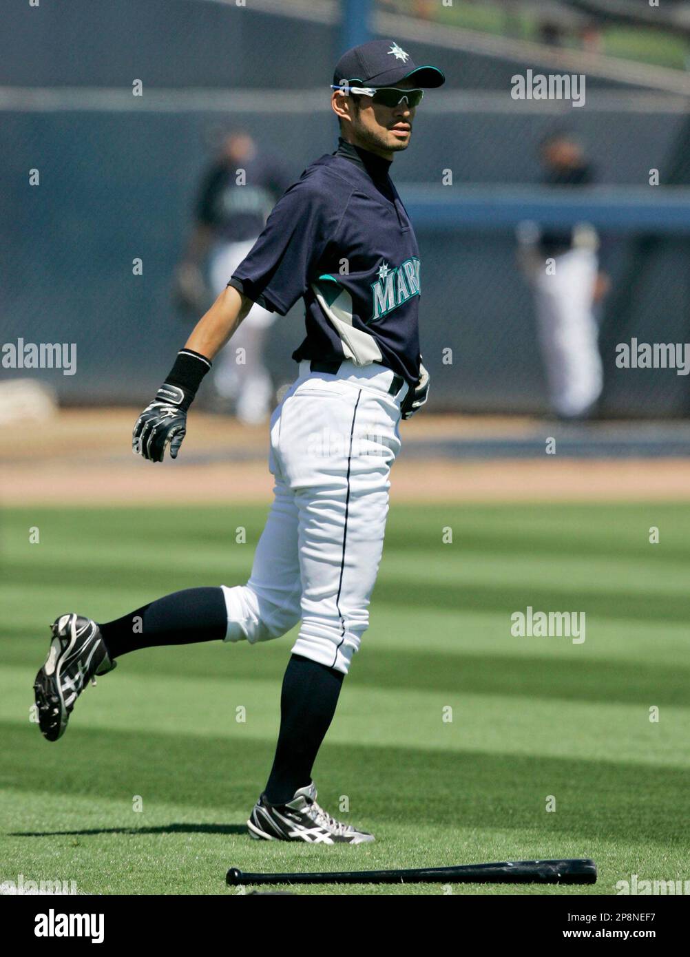 Ichiro Rookie Spring Training Seattle Mariners' Ichiro Suzuki, of Japan, warms up before the start of ...