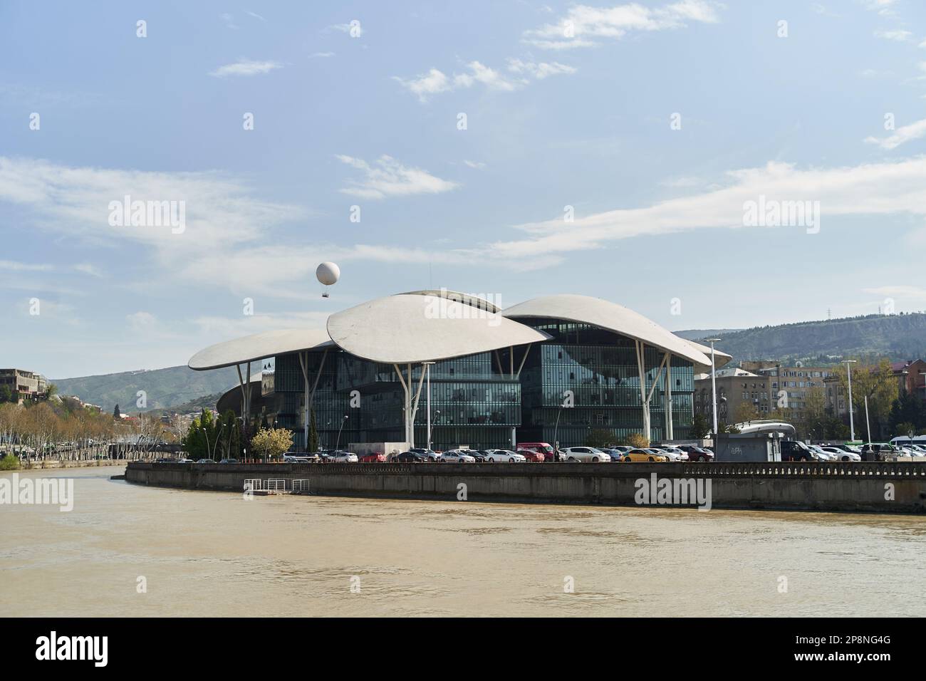 Tbilisi, Georgia - 15.04.2021: Georgia Public Service Hall building across the Kura River. Stock Photo