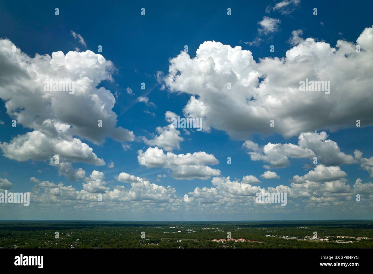 White puffy cumulus clouds on summer blue sky Stock Photo - Alamy