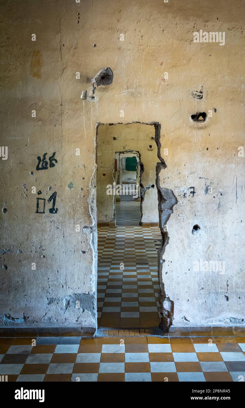 Doorways punched through concrete walls linking former former classrooms in the notorious Tuol Sleng S-21 torture and genocide prison museum in Phnom Stock Photo