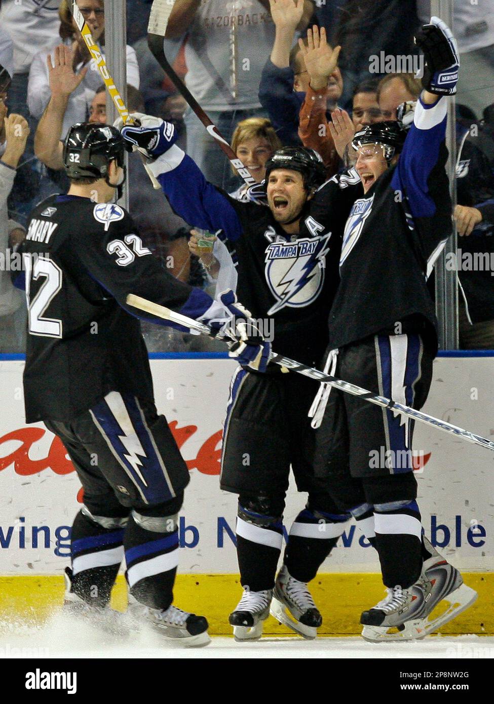 Tampa Bay Lightning's Martin St. Louis, center, celebrates with ...