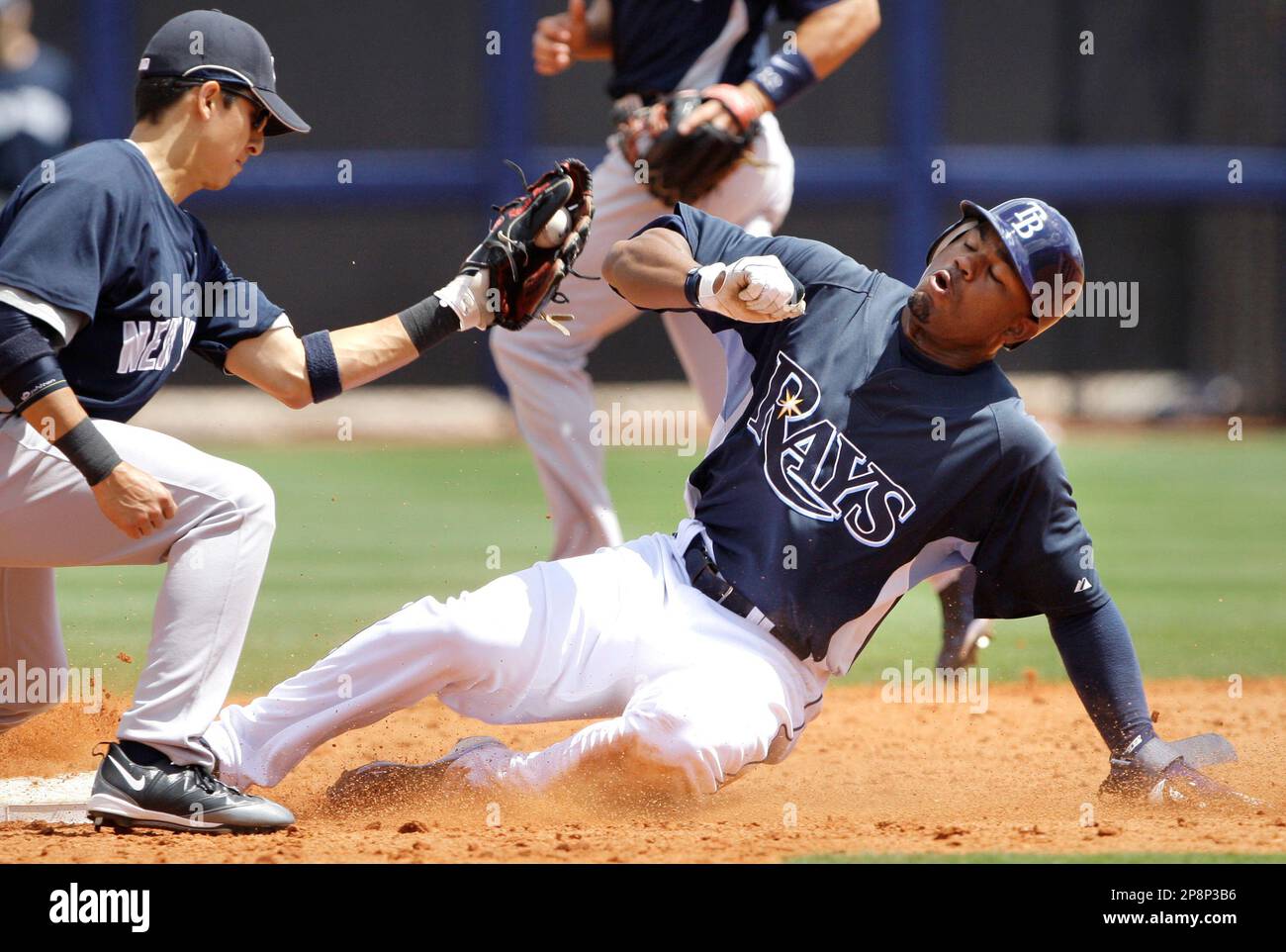 Tampa Bay Rays Carl Crawford, right, gets caught stealing by New York