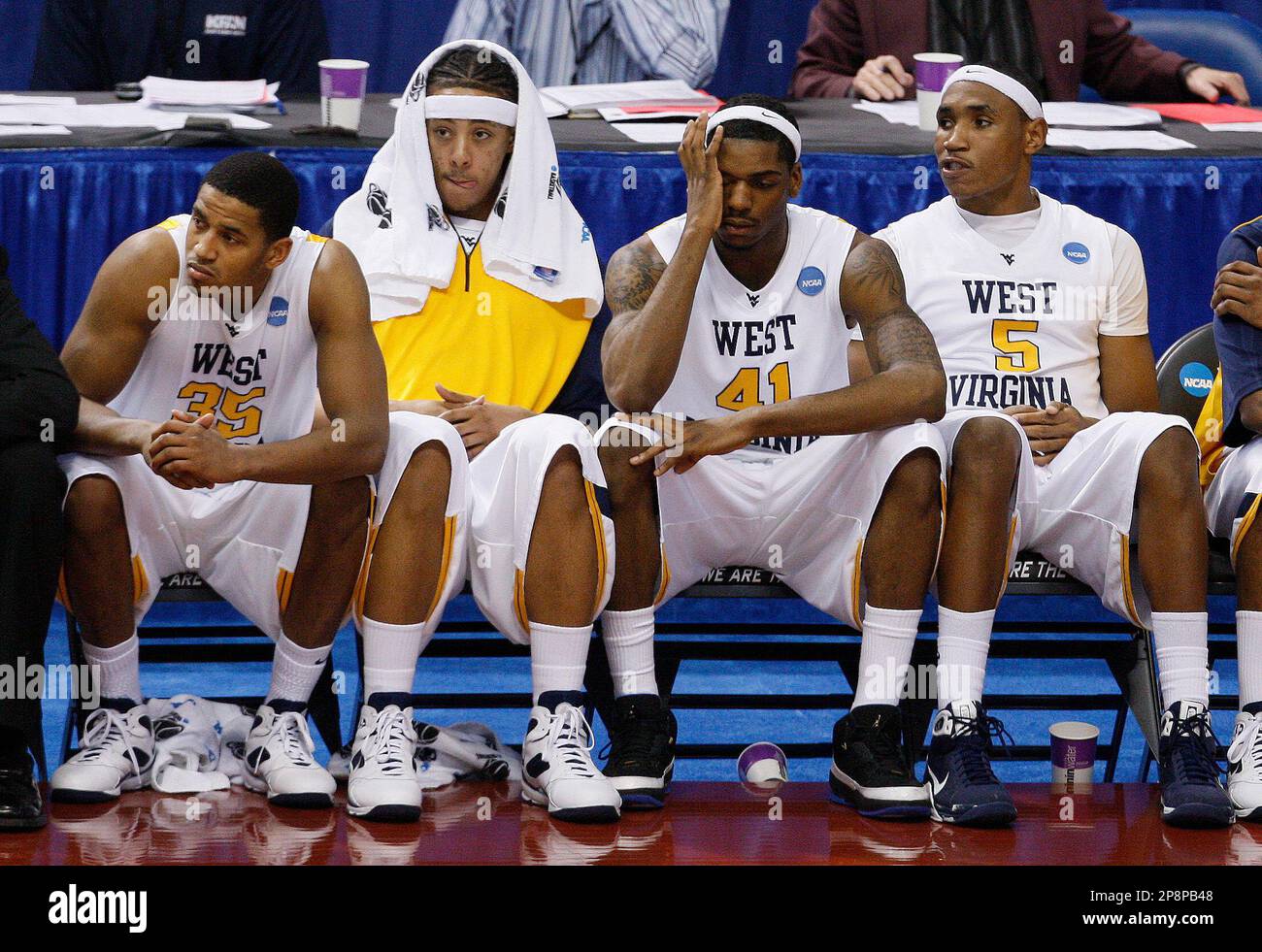 West Virginia's Wellington Smith (35), left to right, Dee Proby, John