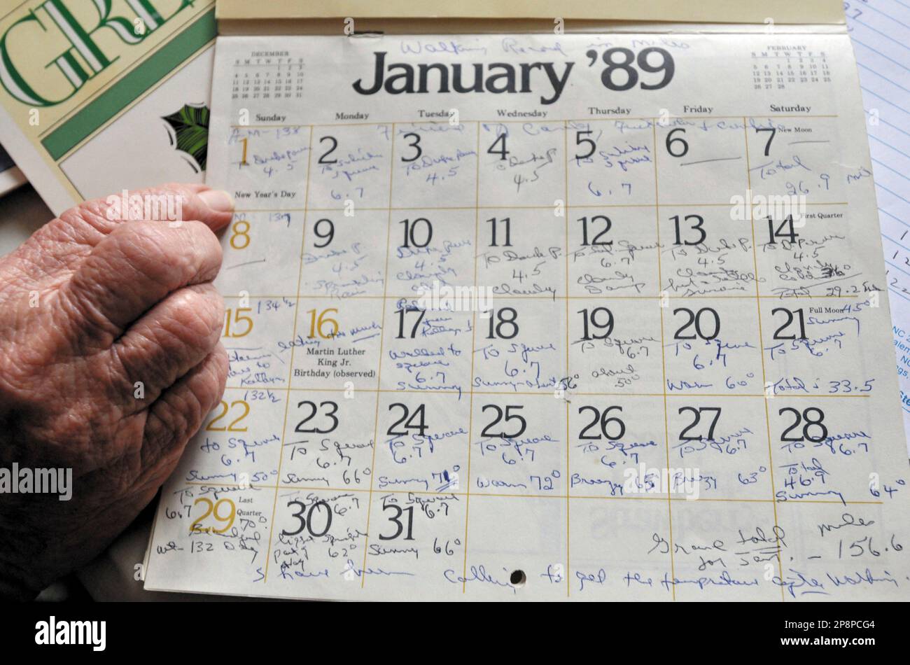 ADVANCE FOR WEEKEND EDITIONS, MARCH 21-22 ** Marie Hocutt, A 86-year-old  Spencer resident, looks at her calendar in Spencer, N.C., on March 11,  2009. In January of 1989 she started walking