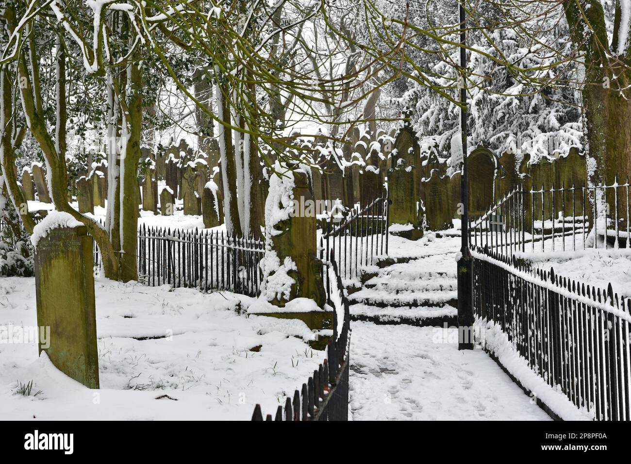 Haworth Bronte Parsonage Museum graveyard under snow, West Yorkshire ...