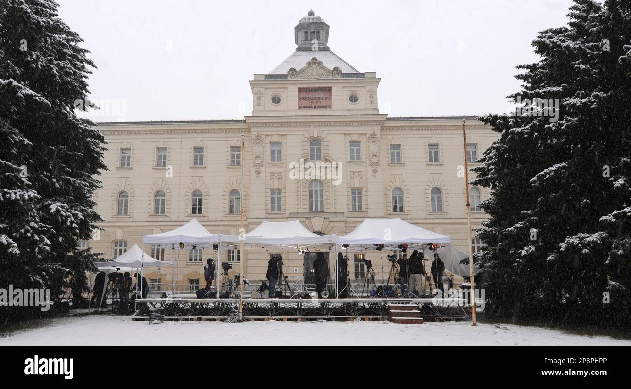 Journalist take their positions on a media platform in front of the provincial court in St. Poelten, Austria, on Thursday, March 19, 2009. An Austrian prosecutor is urging a jury to hand down a life sentence to Josef Fritzl, who imprisoned his daughter in a windowless cell for 24 years and fathered her seven children. (AP Photo/Christof Stache) Stock Photo