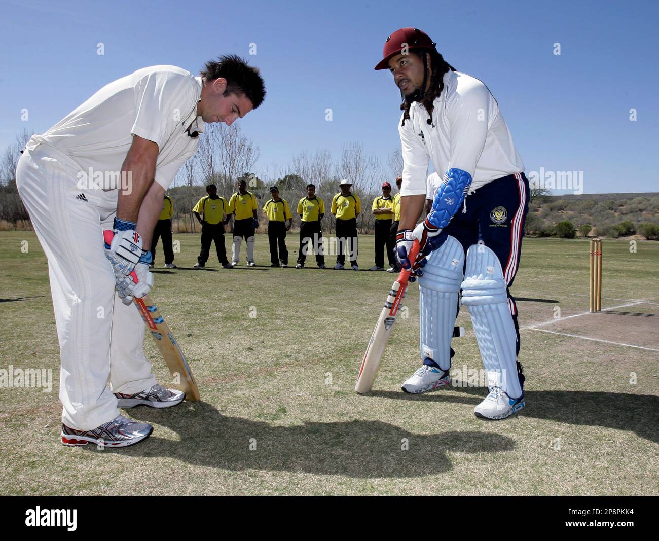 Australian cricketer Shaun Marsh, left, instructs Los Angeles Dodgers slugger Manny Ramirez, right, in cricket batting technique Wednesday, March 18, 2009, at the Arizona Cricket Clubs pitch in Gilbert, Ariz
