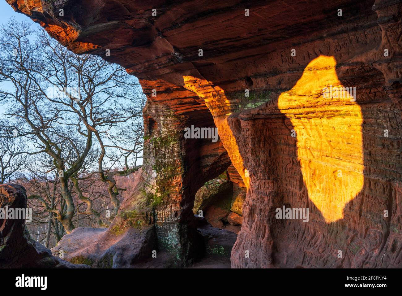 England, West Midlands, Kinver Edge. Carved graffiti in the sandstone walls of the caves in Nannys Rock. Stock Photo