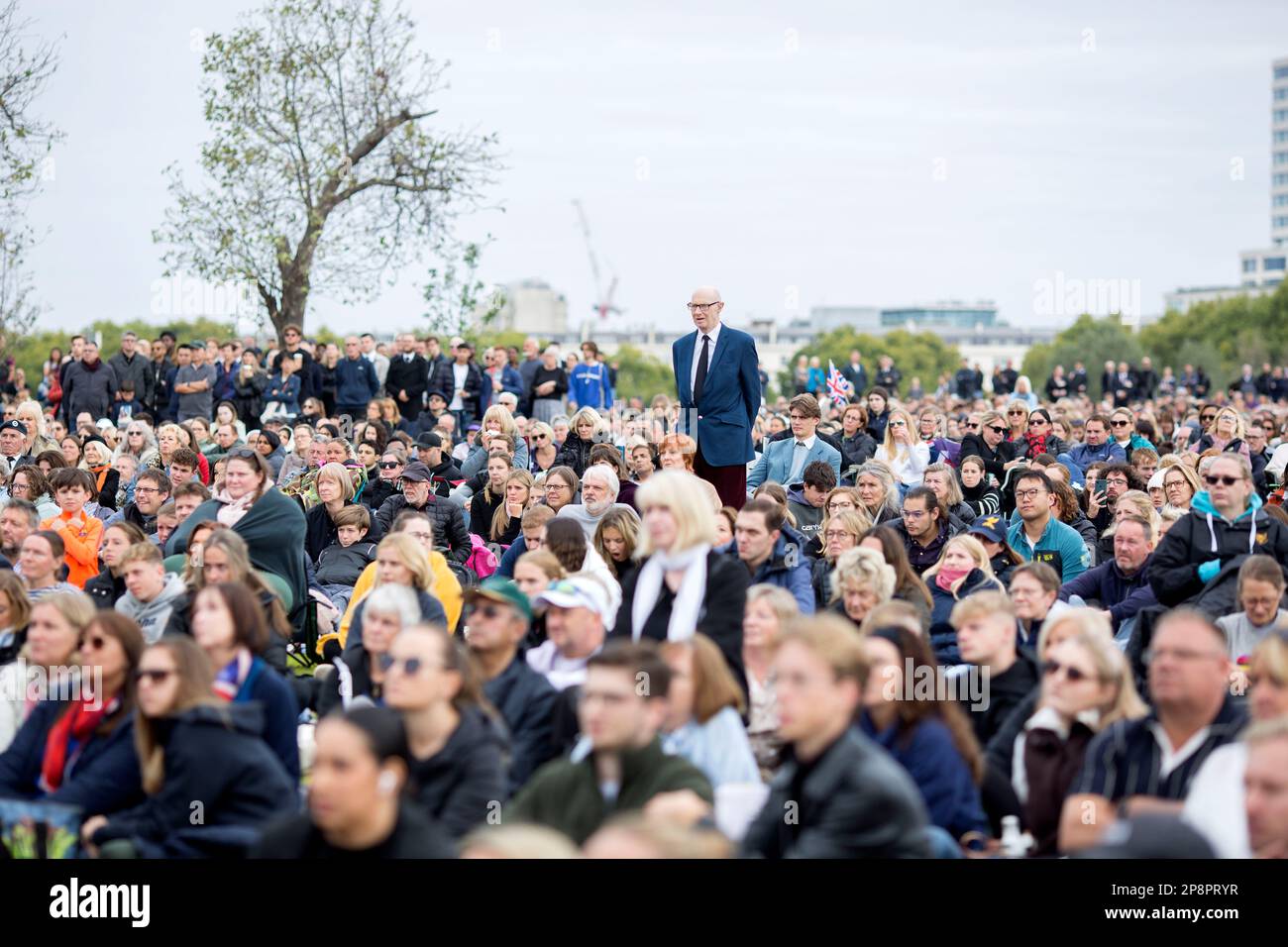 People watch the TV coverage of the late Queen Elizabeth II’s funeral