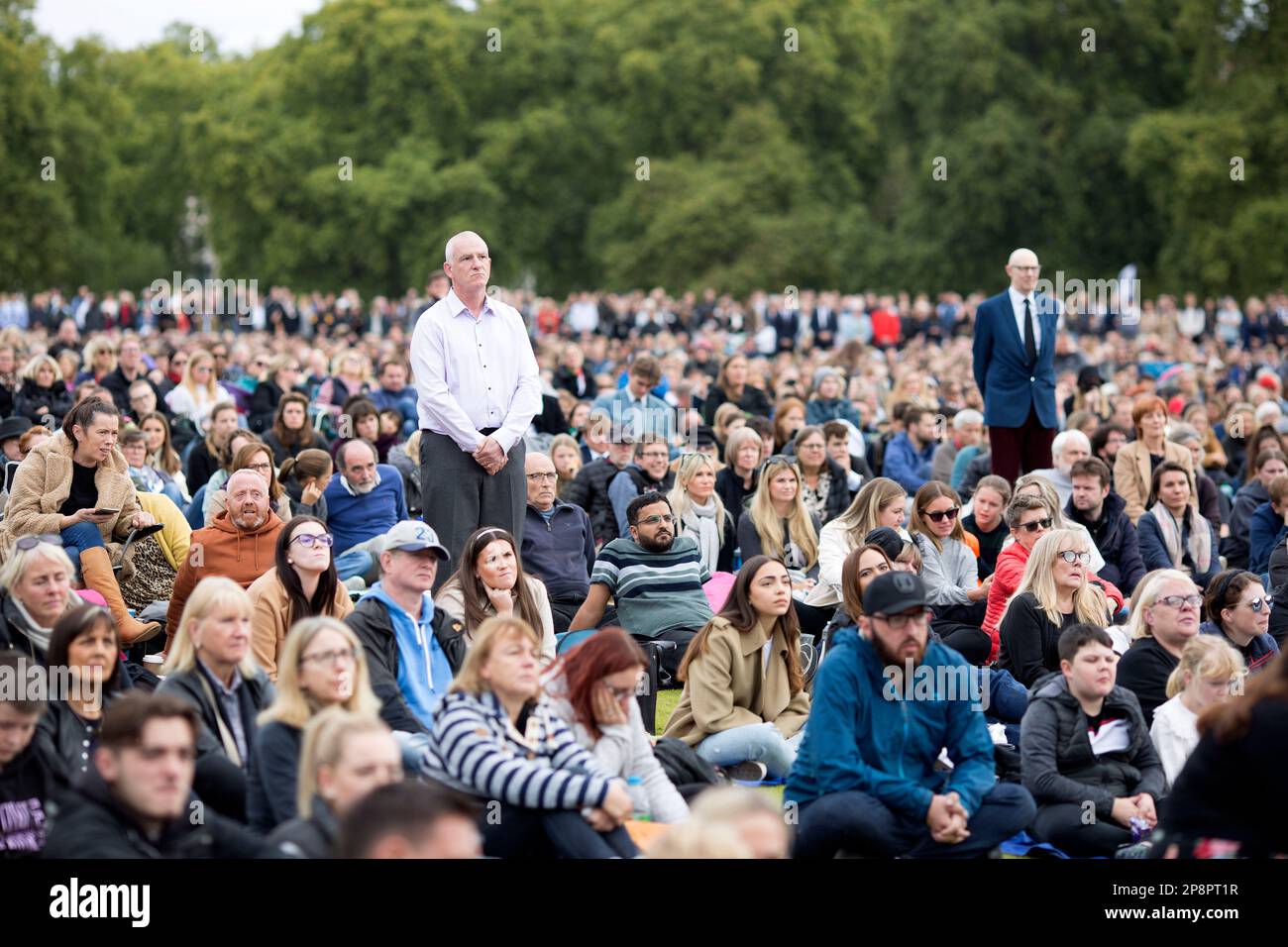 People watch the TV coverage of the late Queen Elizabeth II’s funeral