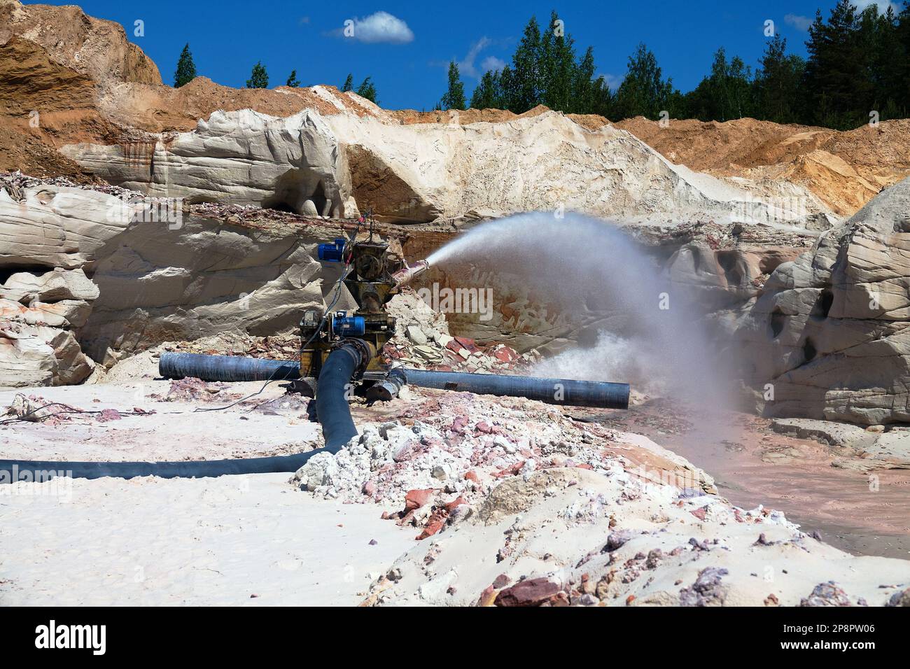 Foamy muddy water gushes out of the pipe under high pressure. Discharge