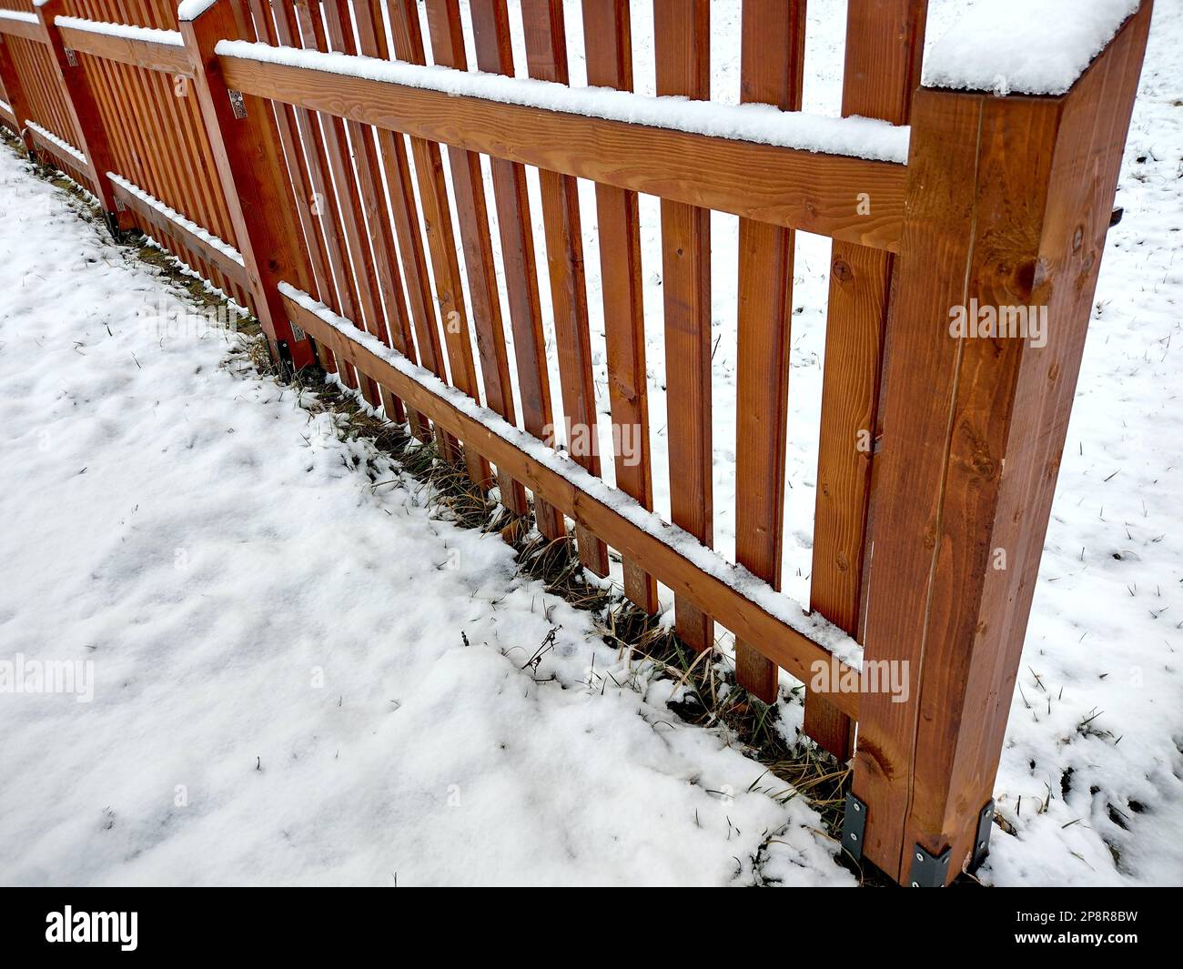 snow on a wooden fence Stock Photo - Alamy