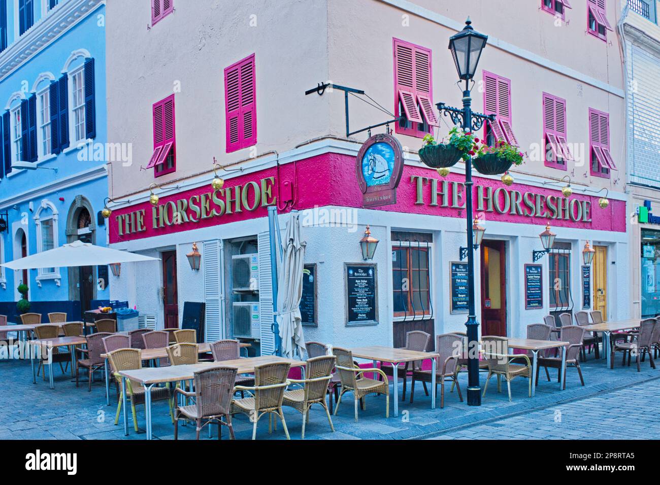 Waiting For Opening Time, The Horseshoe Public House Gibraltar Stock