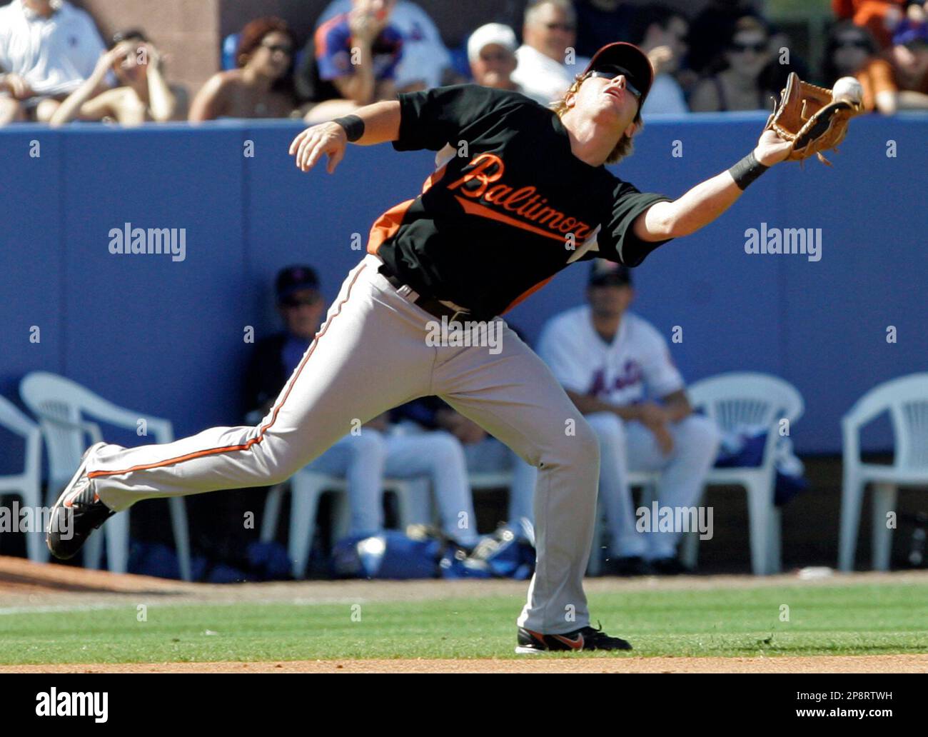 Baltimore Orioles second baseman Justin Turner, top, throws to first to get  Tampa Bay Rays' Dioner Navarro to complete a double play after putting out  a sliding Jason Bartlett in the third