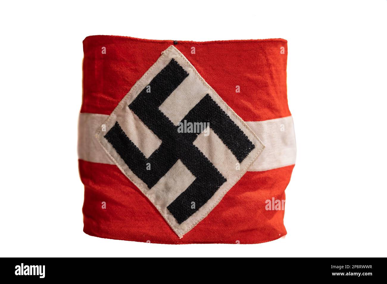 A small piece of fabric with the Nazi flag on it isolated on a white background Stock Photo