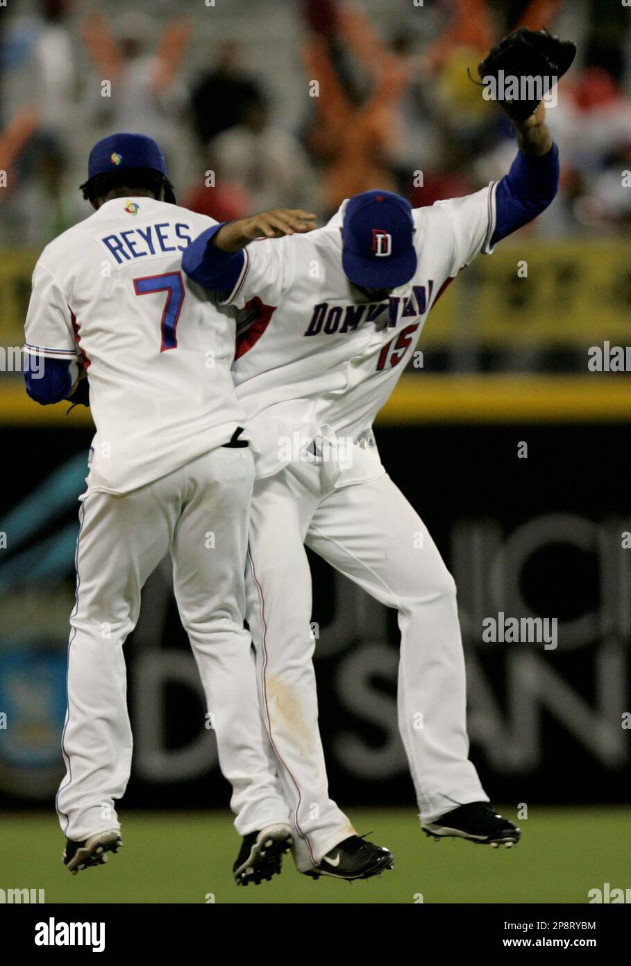 Dominican Republic's Jose Reyes, left, celebrates with teammate Nelson Cruz  their 9-0 victory over Panama at a World Baseball Classic game in San Juan,  Sunday, March 8, 2009. (AP Photo/Fernando Llano Stock