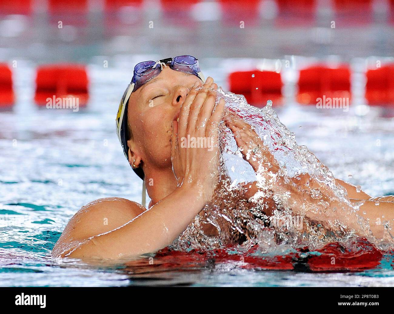 Olympic champion Federica Pellegrini reacts after lowering her world record  in the 200-meter freestyle at an Italian swim meet in Riccione, Italy,  Sunday, March 8, 2009. Pellegrini clocked 1 minute, 54.47 seconds,