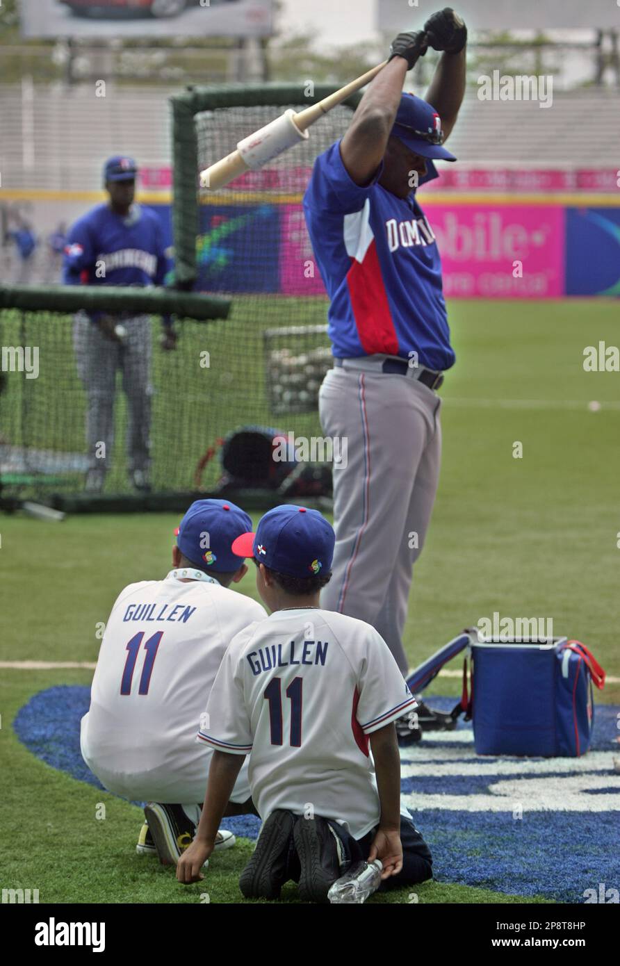 Jose Jr. and Manuel Guillen, watch as their father, Dominican Republic