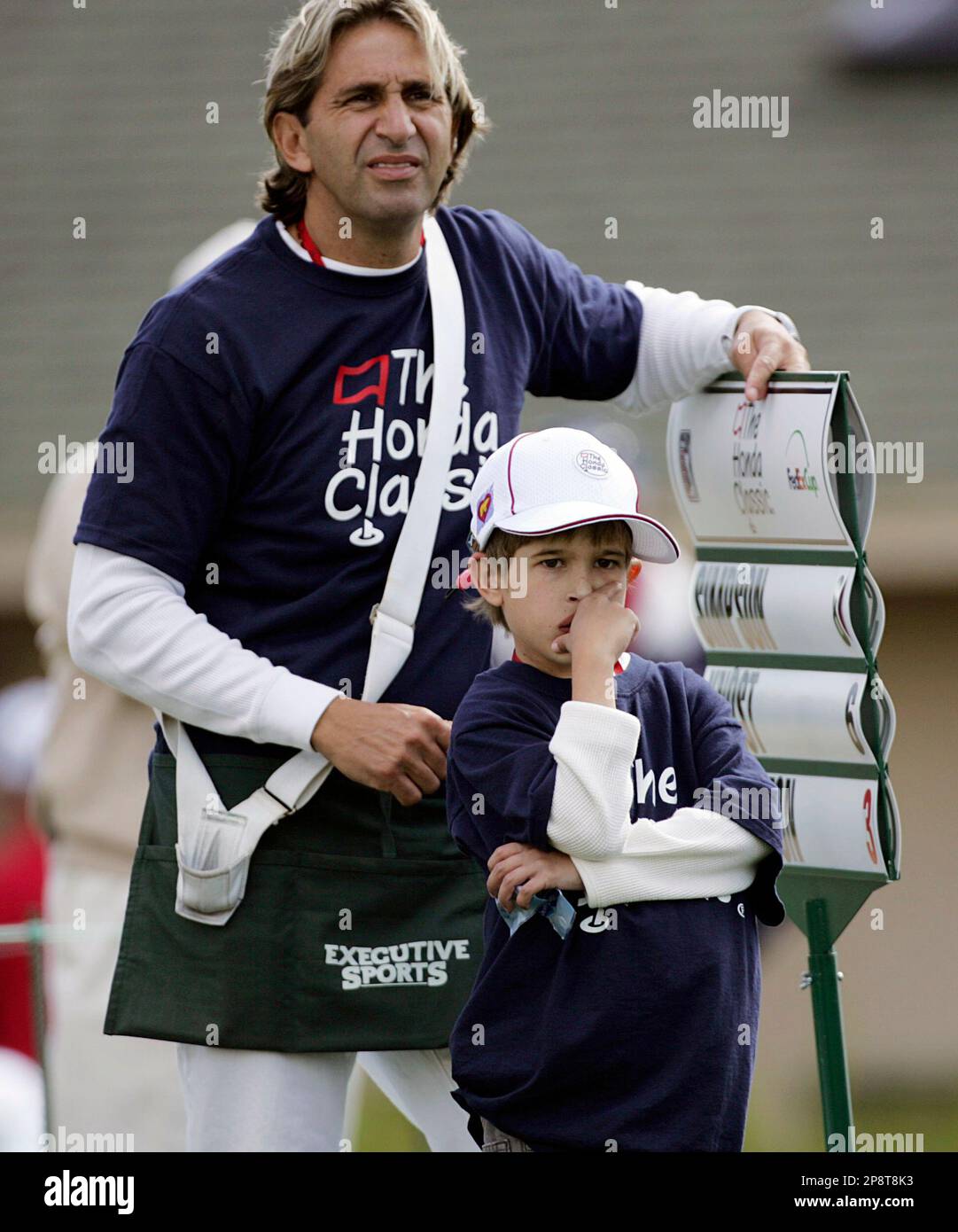 John Paul and his dad, Derek, serve as standard bearer for the Erik Compton group during