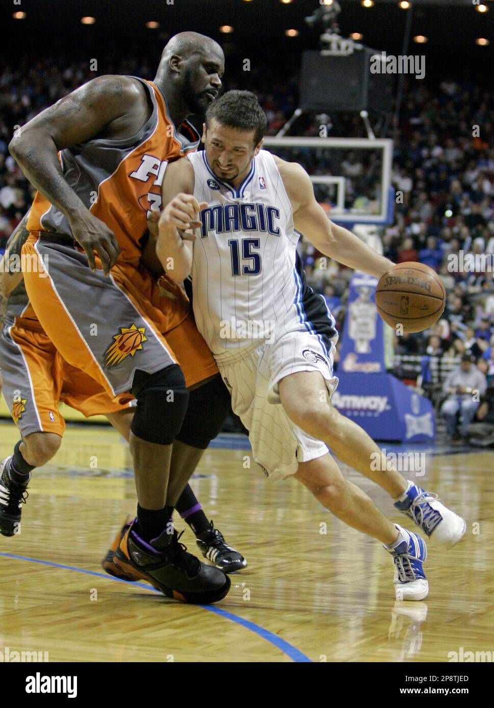 Orlando Magic forward Hedo Turkoglu (15), of Turkey, pushes his way past  Phoenix Suns center Shaquille O'Neal during the second half of an NBA  basketball game in Orlando, Fla., Tuesday, March 3,