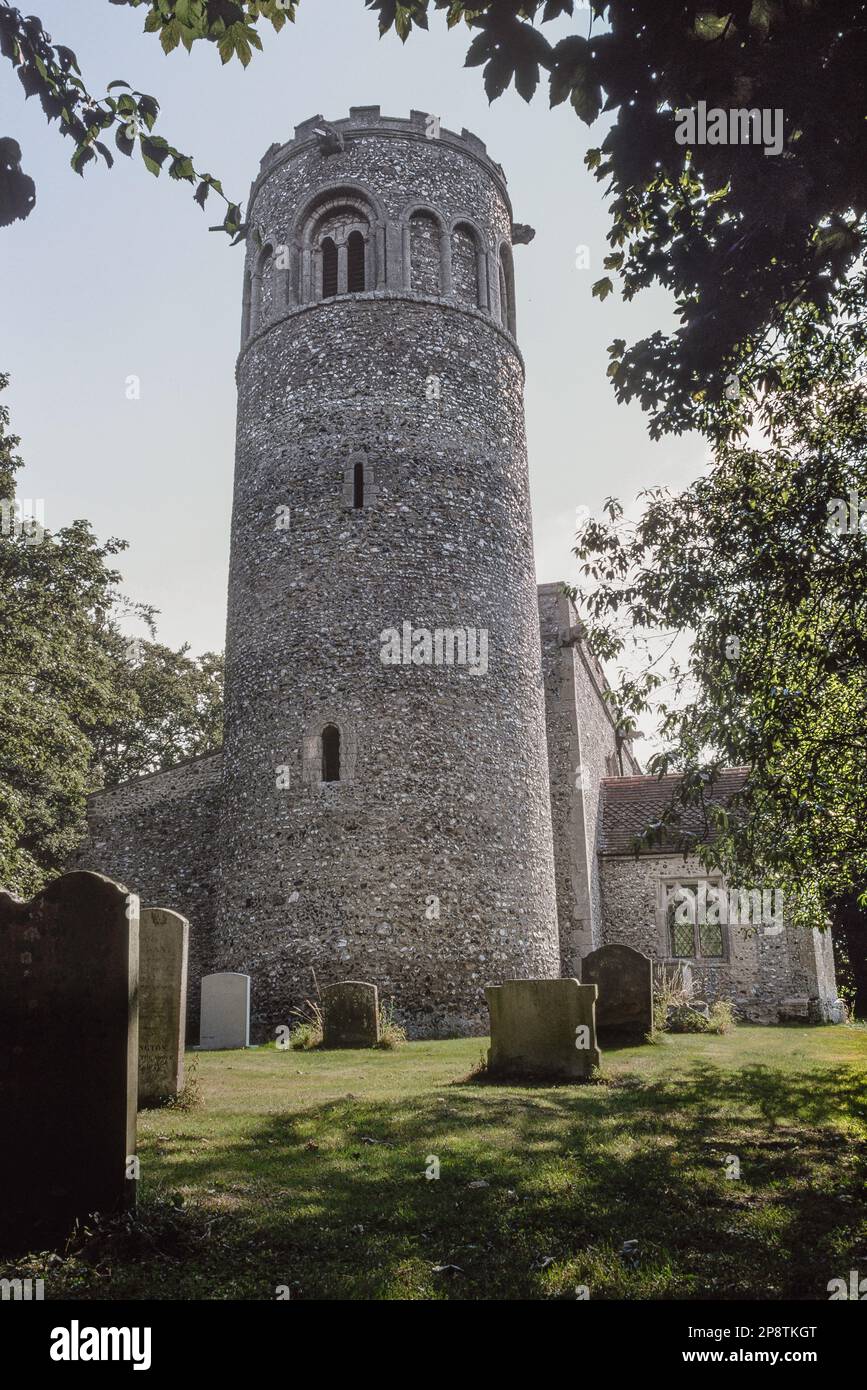 Round tower church, view of the tower of St Nicholas church in Little Saxham whose architecture spans Norman and medieval periods, Suffolk, England UK Stock Photo