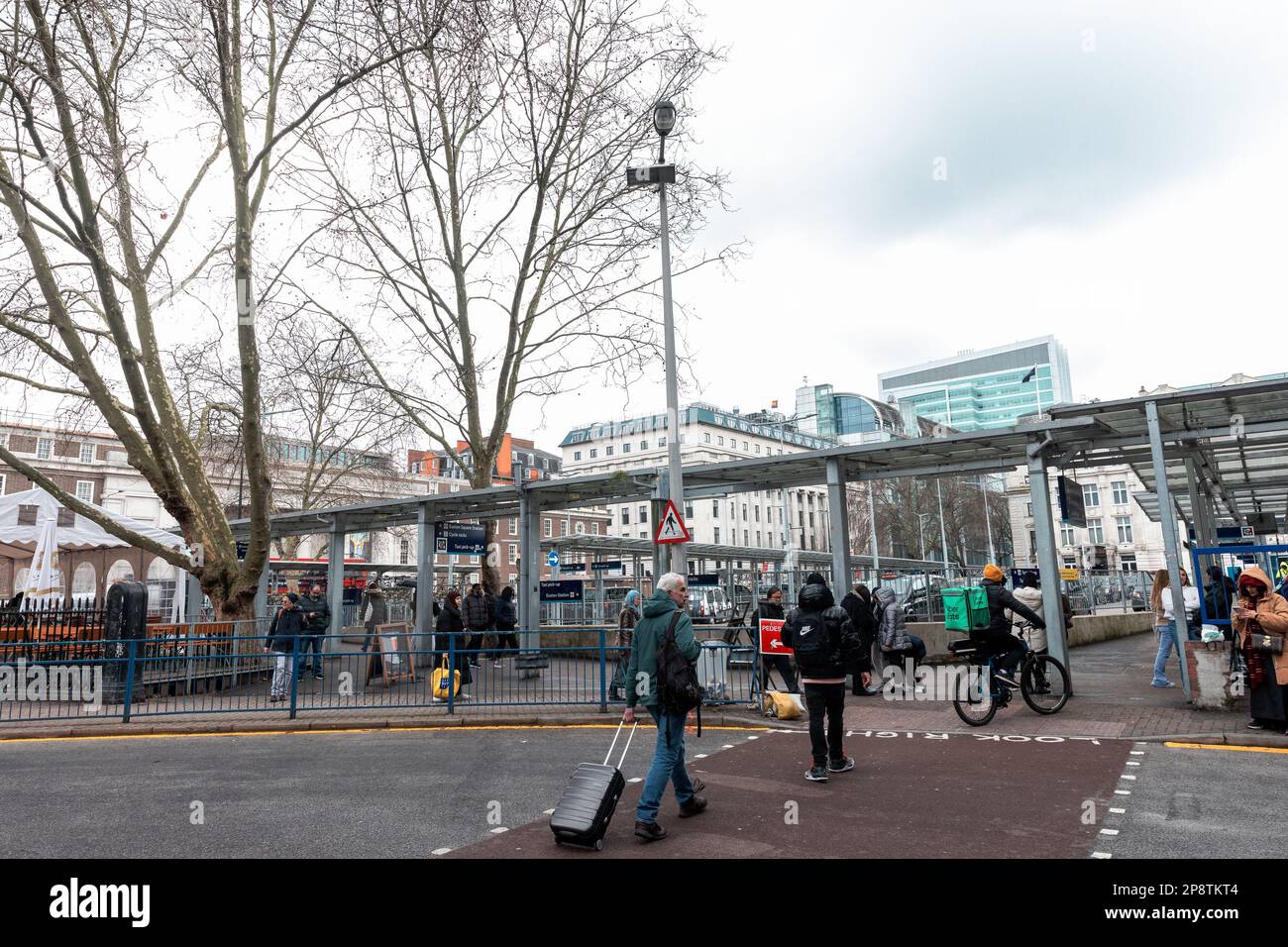 London, UK. 7th March, 2023. Members of the public pass around the former Euston Square Gardens West, where several mature trees have recently been felled for the HS2 high-speed rail link. Euston is an area of London with few green spaces and where EU air quality standards have been regularly infringed. Credit: Mark Kerrison/Alamy Live News Stock Photo