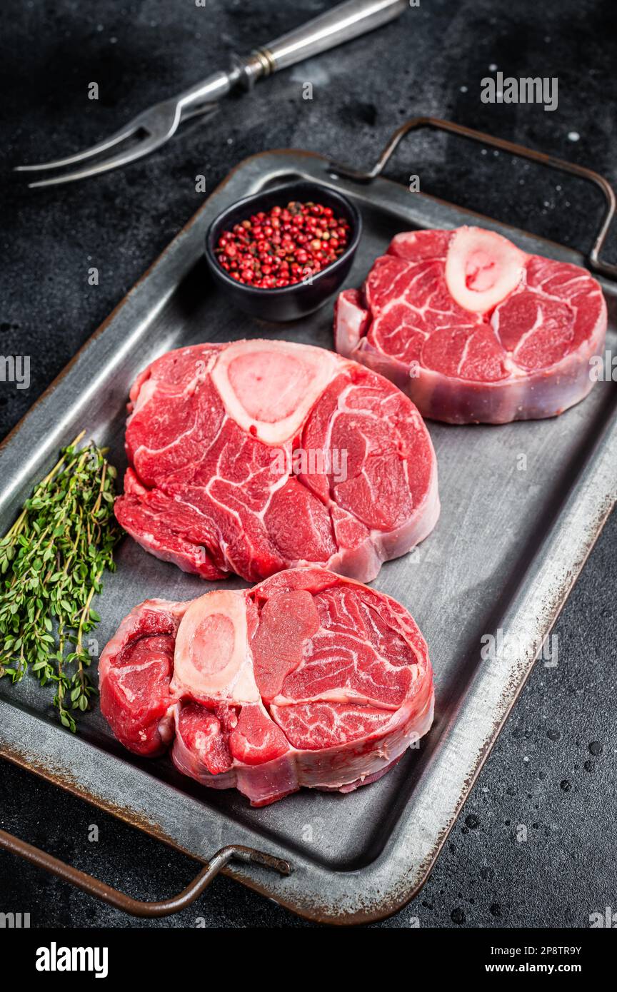 Fresh Raw Osso buco Veal steak, cross cut veal shank Ossobuco. Black