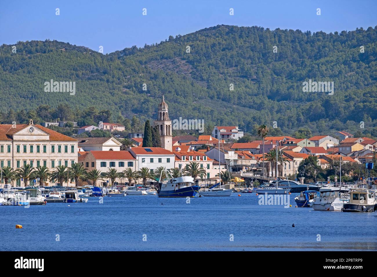 St. Joseph church and harbour of the little town Vela Luka on the island Korčula in the Adriatic Sea, Dalmatia, Dubrovnik-Neretva County, Croatia Stock Photo