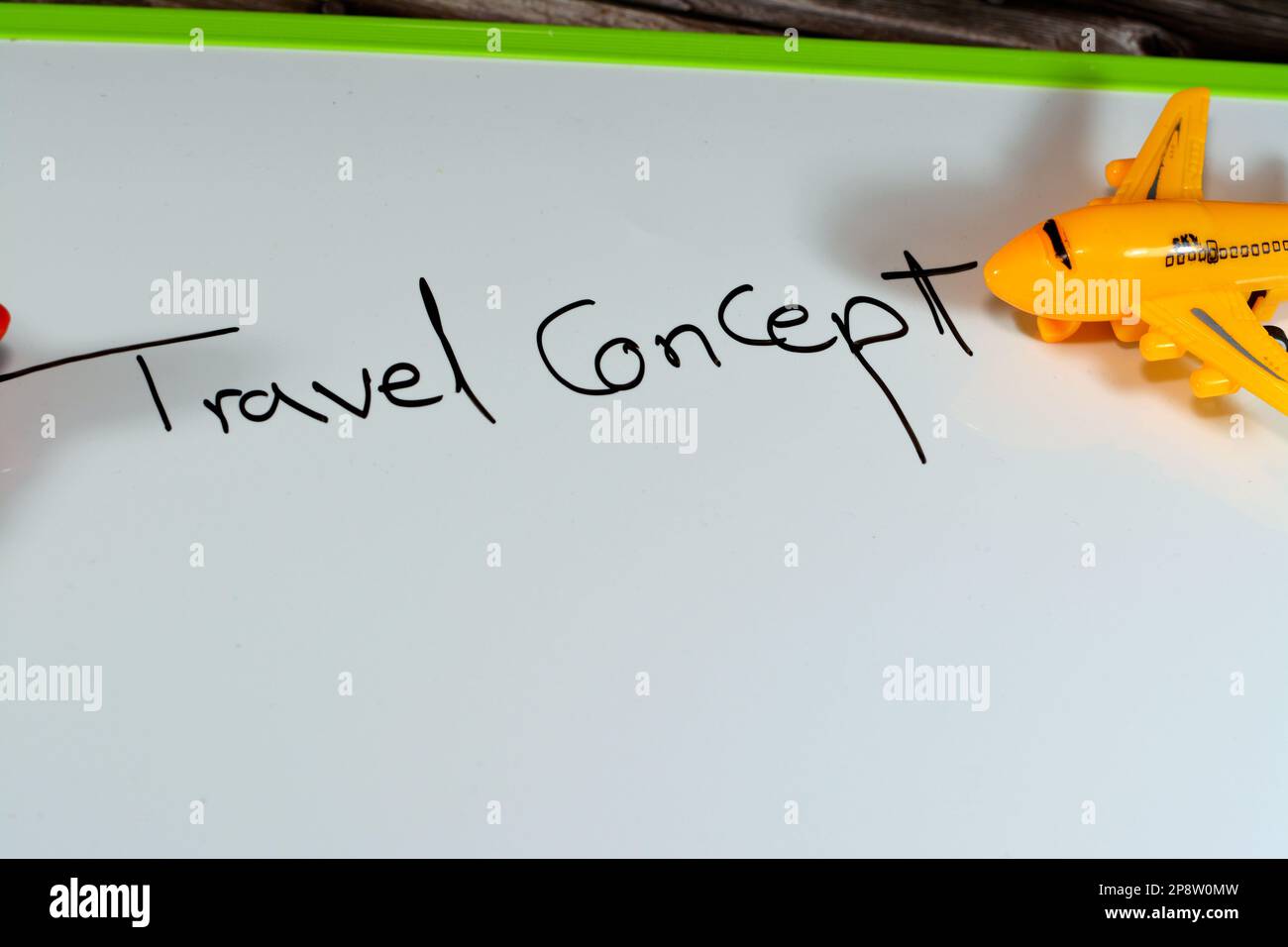 English text on a board ( Travel concept ) with a small airplane beside the text, business flights, tourism, traveling around the world, countries tou Stock Photo