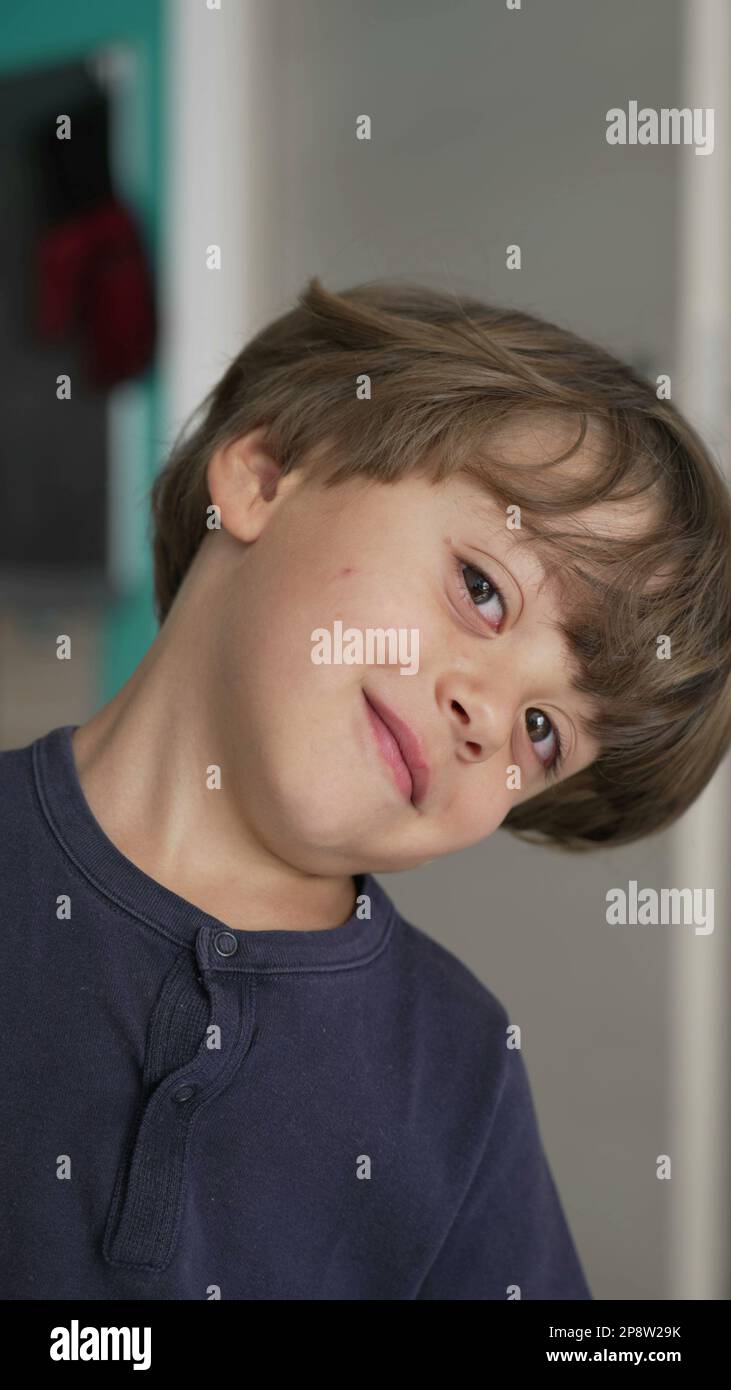 One playful little boy close up face looking at camera. Portrait of an ...