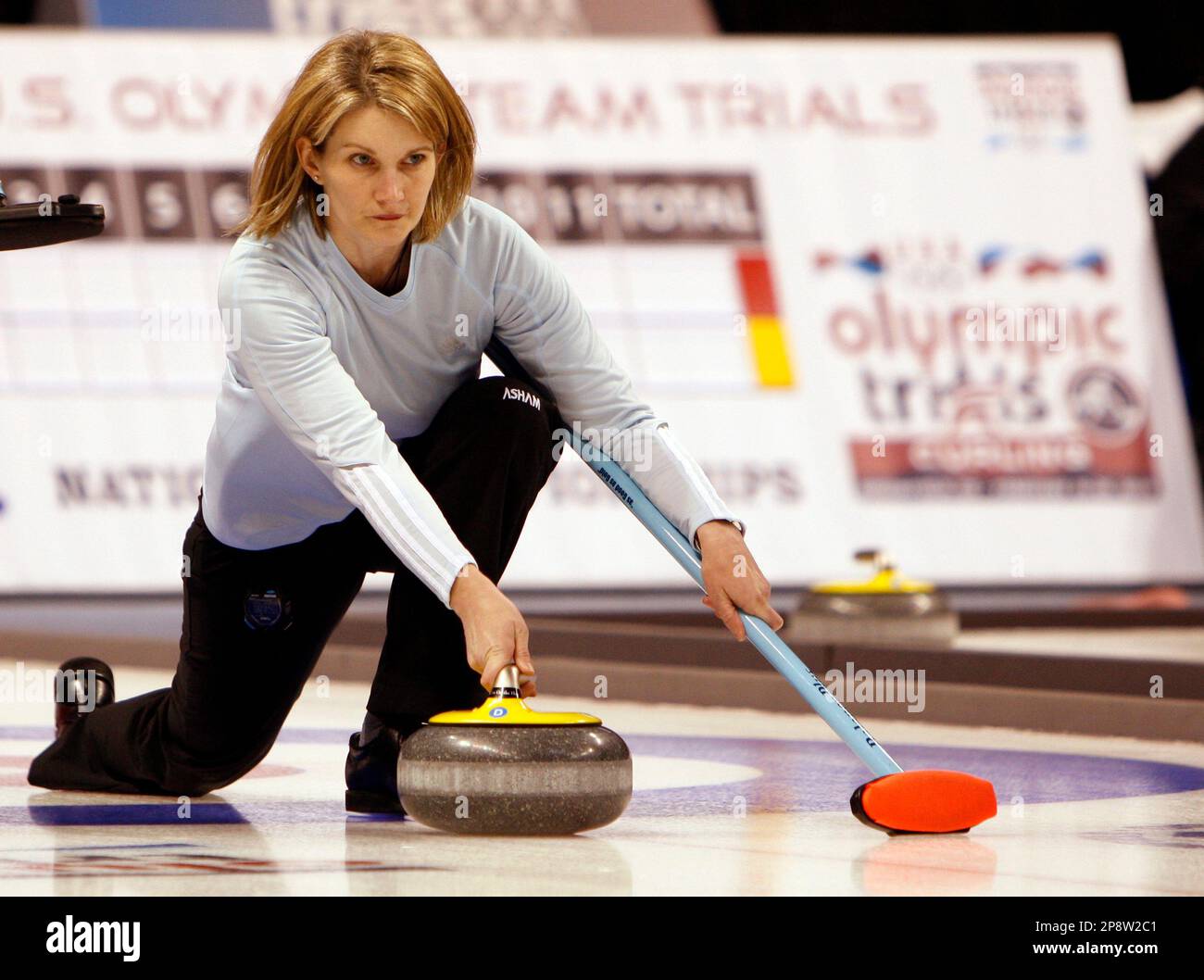 Skip Erika Brown, who now lives in Oakville, Ontario, Canada, but hails originally from Madison, Wis., releases a stone during the fifth draw at the USA Olympic Curling Trials in Broomfield, Colo.,