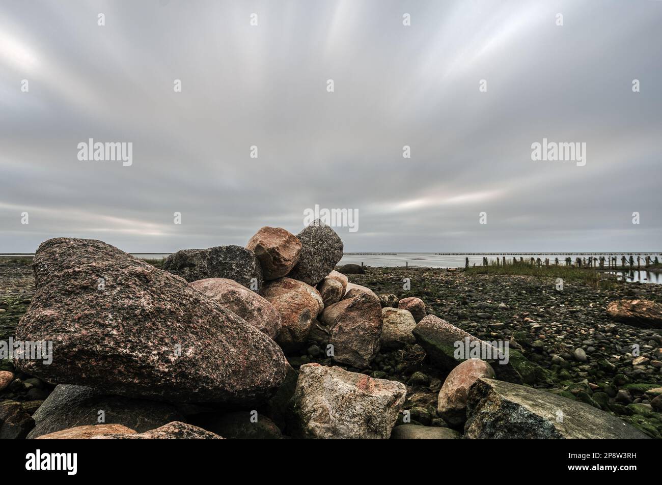 Sea Scapes Rocks A scenic seascape with huge rocks on top of each other near the pier ...