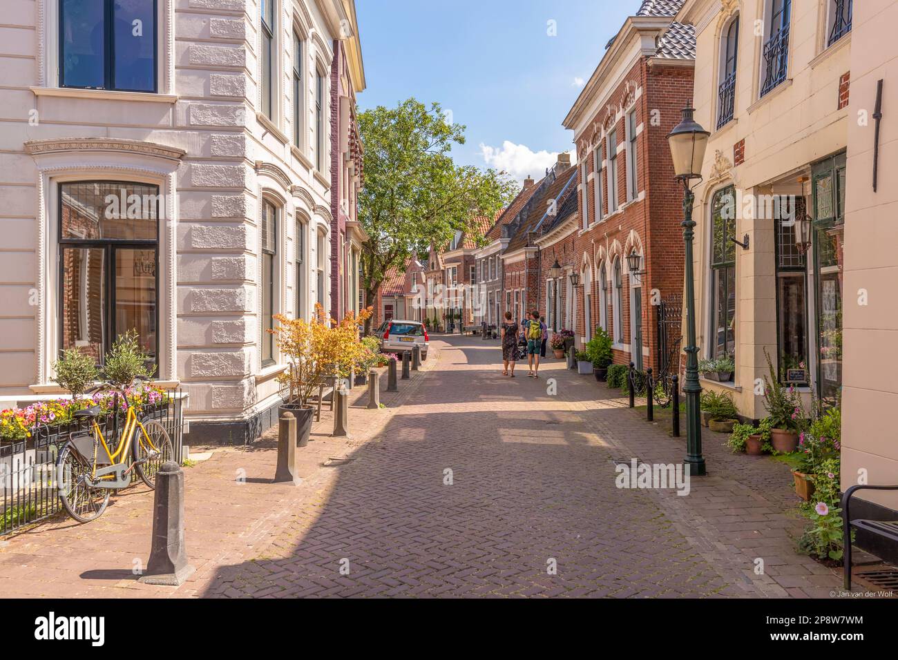 Narrow street with old houses in the picturesque town of Appingedam in the province of Groningen; Netherlands. Stock Photo