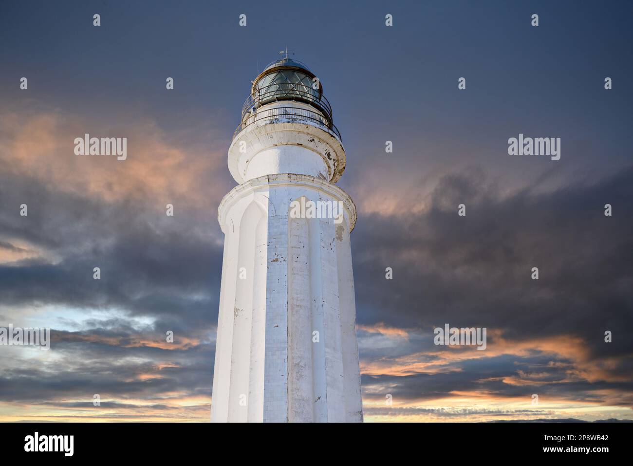 Sunset views of the Cabo Trafalgar Lighthouse located in Caños de Meca, Barbate, Cádiz Stock Photo