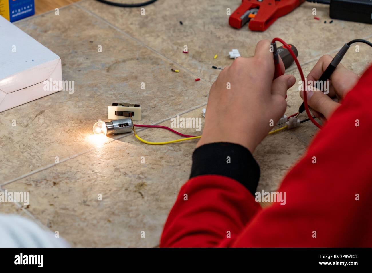 Electrical installation with light bulb and switch Stock Photo