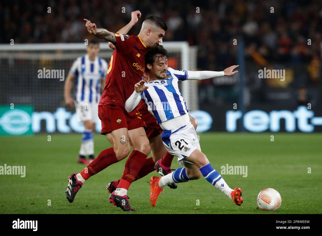 Rome, Italy. 09th Mar, 2023. David Silva, right, of Real Sociedad, is challenged by Gianluca Mancini, of AS Roma, during the UEFA Europa League round of 16 first leg football match between Roma and Real Sociedad at RomeÕs Olympic stadium, March 09, 2023. Credit: Riccardo De Luca - Update Images/Alamy Live News Stock Photo