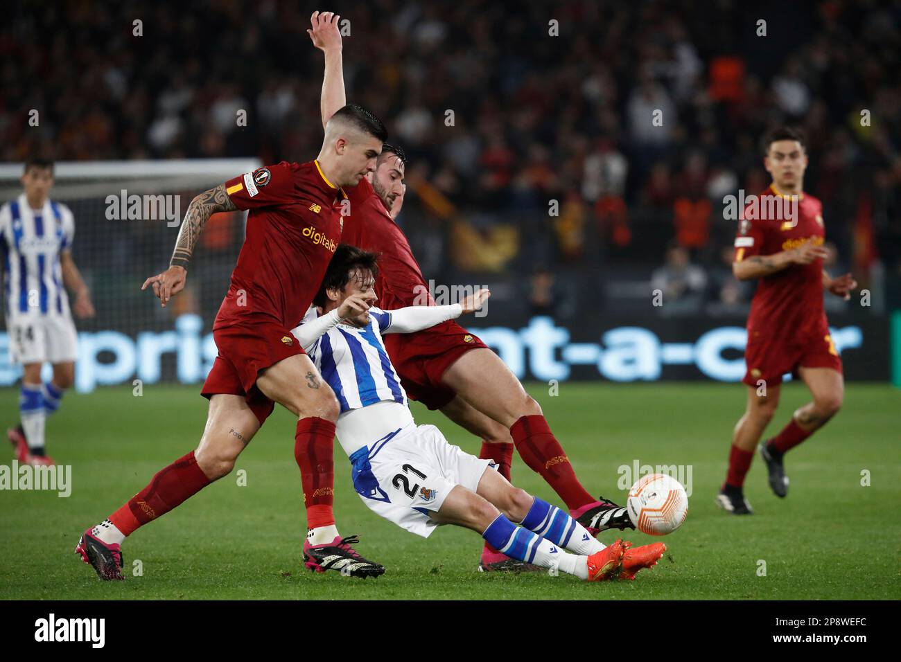Rome, Italy. 09th Mar, 2023. David Silva, center, of Real Sociedad, is challenged by Gianluca Mancini, left, and Bryan Cristante, of AS Roma, during the UEFA Europa League round of 16 first leg football match between Roma and Real Sociedad at RomeÕs Olympic stadium, March 09, 2023. Credit: Riccardo De Luca - Update Images/Alamy Live News Stock Photo