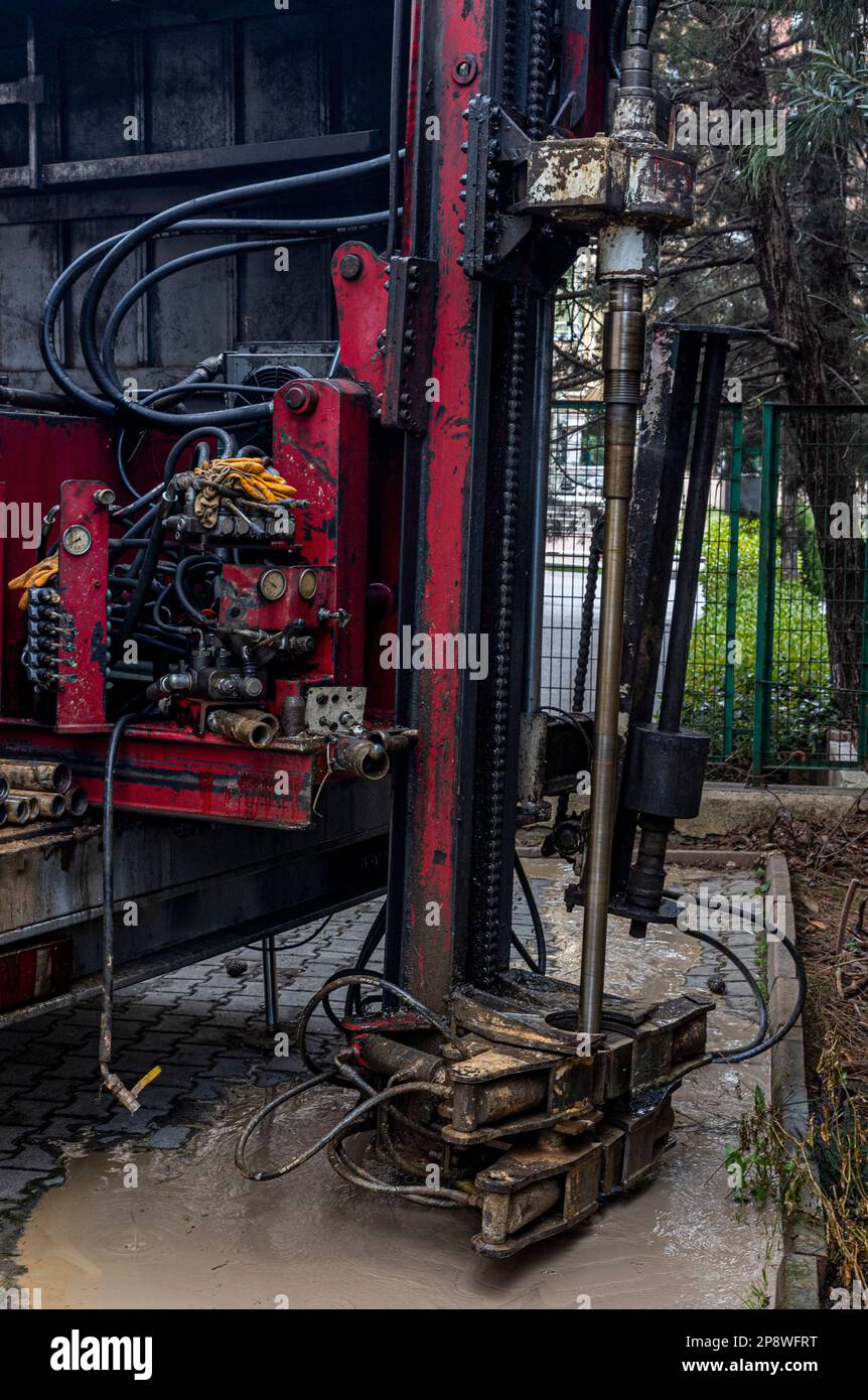 Self-propelled Mini drill rig drills soil for soil investigation. Test drilling, ground survey for information on ground condition. Stock Photo
